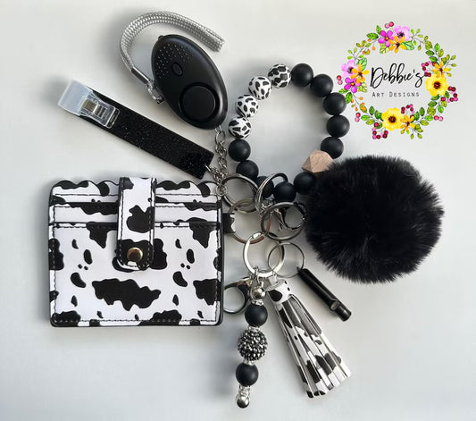 Cow print, Safety keychains, defense, beaded wristlet, accessories, wallet, led light alarm, whistle, card grabber and more, black and white